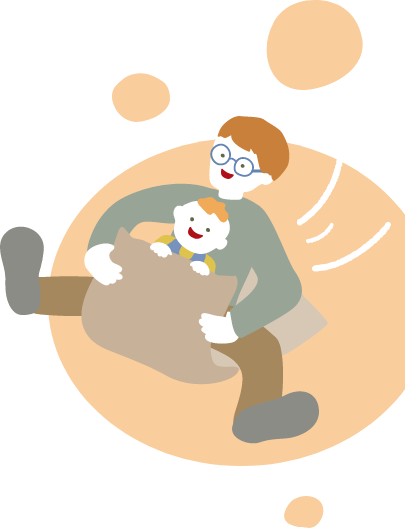 パパとダンボールですべり降りる男の子